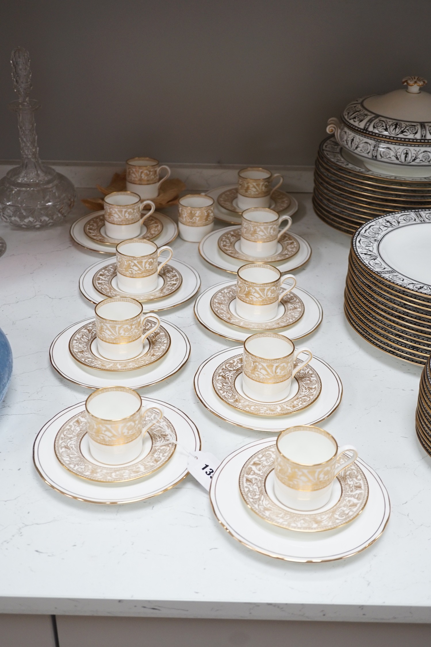 A Victorian Wedgwood part dinner service, with black printed classical borders, together with two Minton meat dishes and a Wedgwood gilt bordered coffee service.